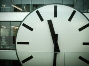 round white and black analog clock
